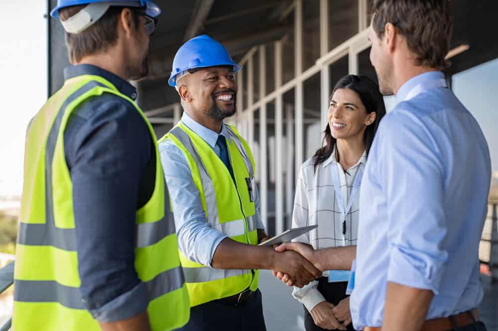4 people agreeing on a construction project plan