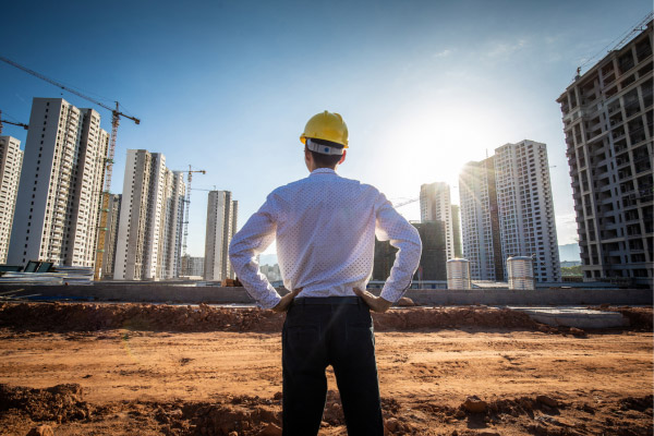 worker looking at construction site