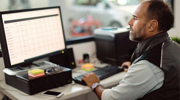A person in front of a computer.