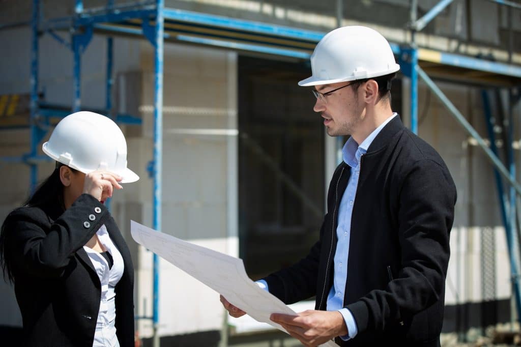 Construction Manager explaining the plan to a colleague