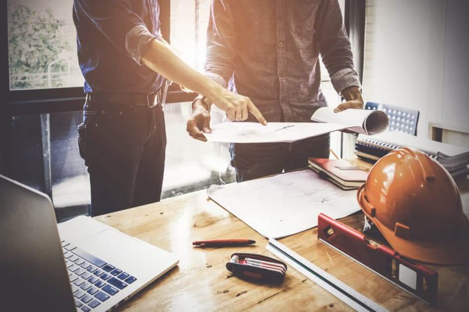 2 Men Working on Construction Plans