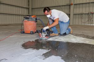 man using floor washer
