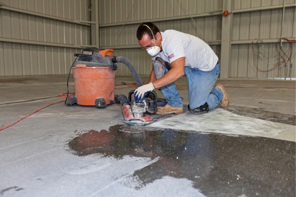 man using floor washer