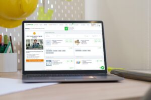 General contractor directory for subcontractors. Computer screen with a PlanHub app on screen.