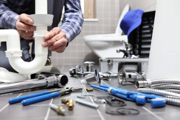 A Plumber Man and Plumbing Equipment