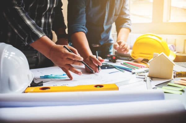 2 Men Working on Construction Plans