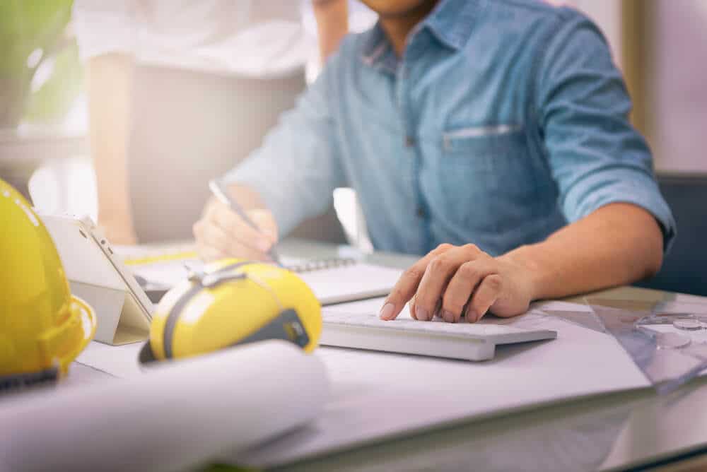 a man working on Construction Plans
