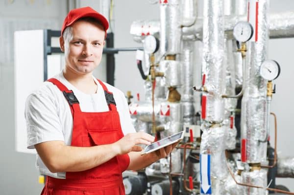 A HVAC Worker with a Tablet